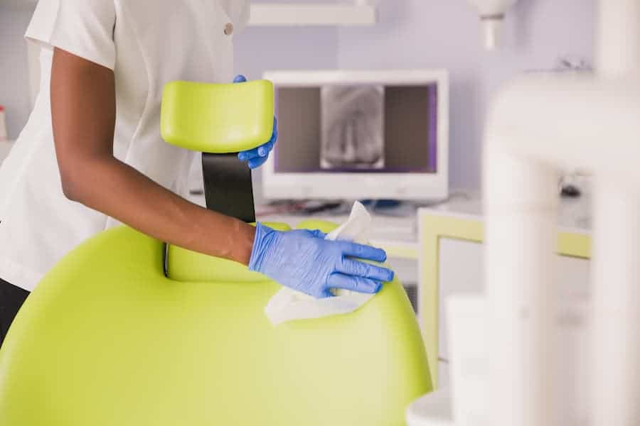 Woman Cleaning Chair at a Medical Facility
