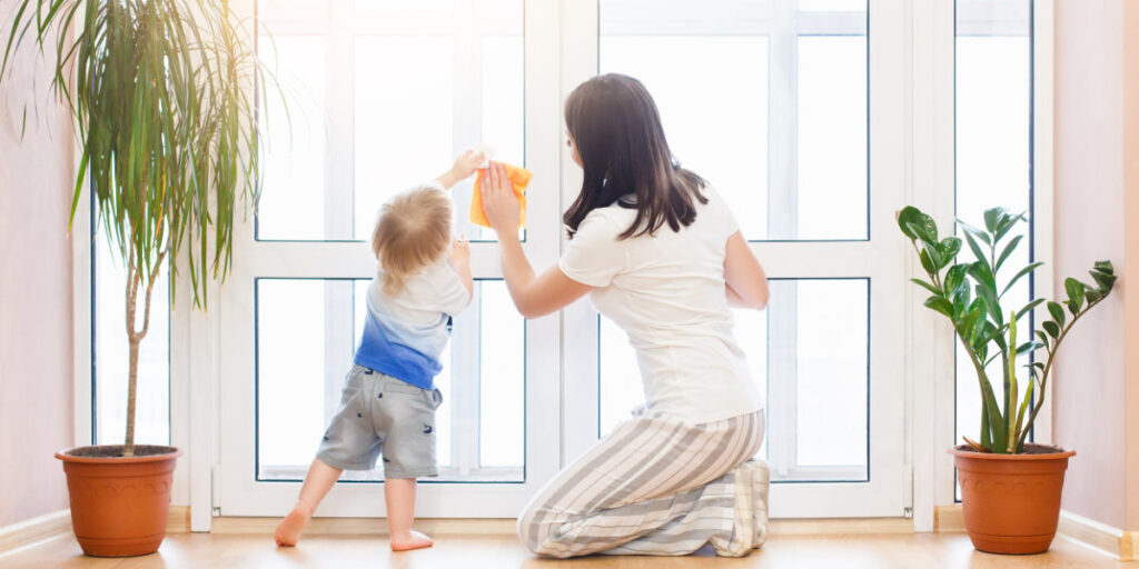 Woman-and-child-cleaning-windows
